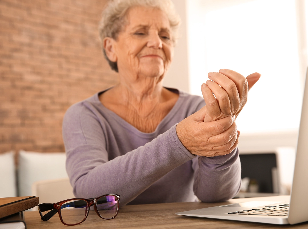 Older woman holding her wrist - Clear Lake, TX Orthopaedic Hand, Wrist & Elbow Surgery