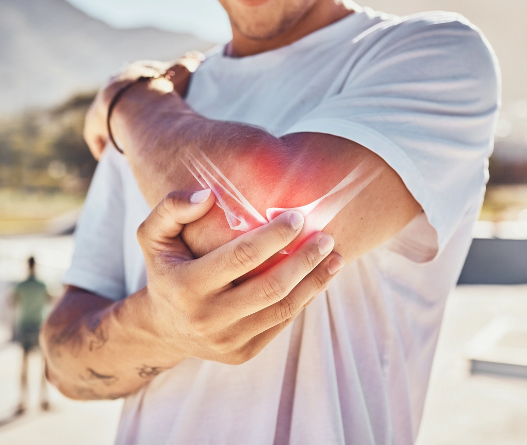 Man grabbing elbow in pain