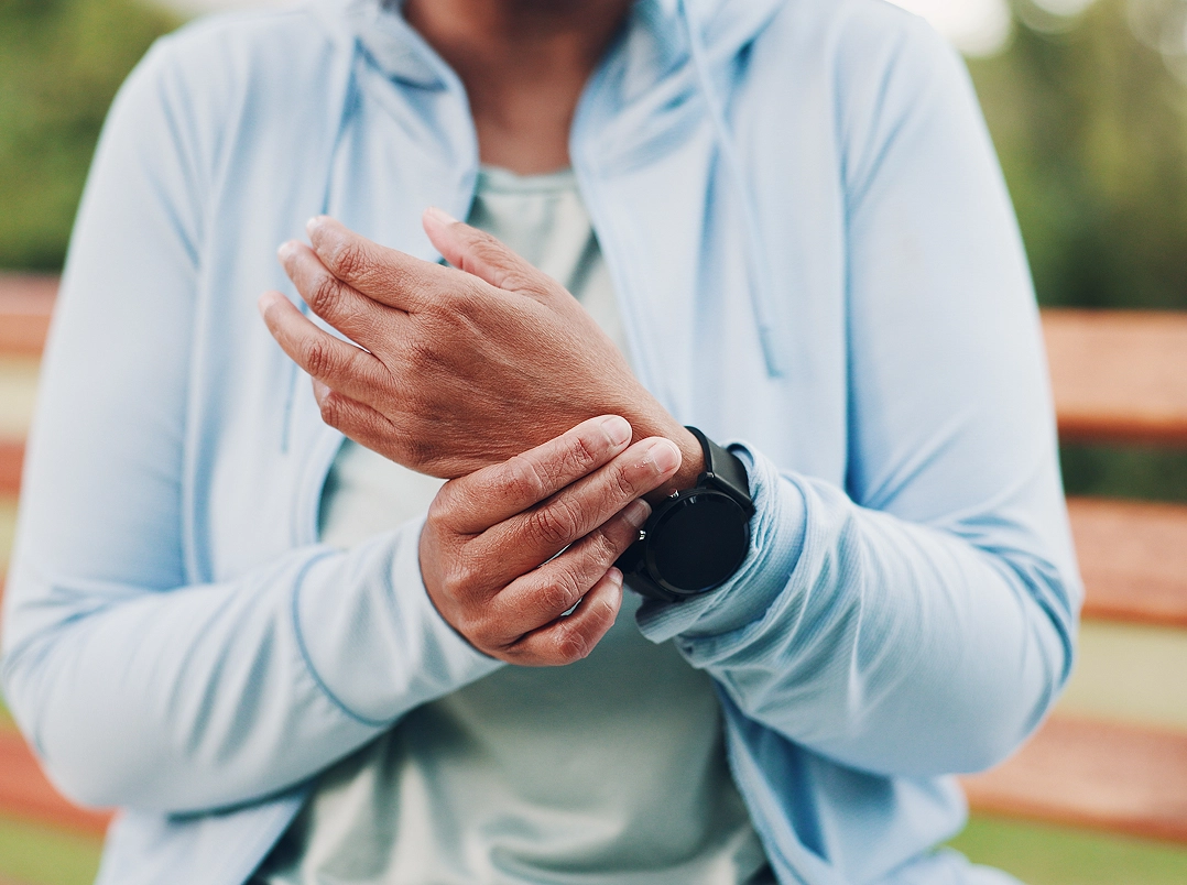 woman holding her wrist - Katy, TX Orthopaedic Hand, Wrist & Elbow Surgery