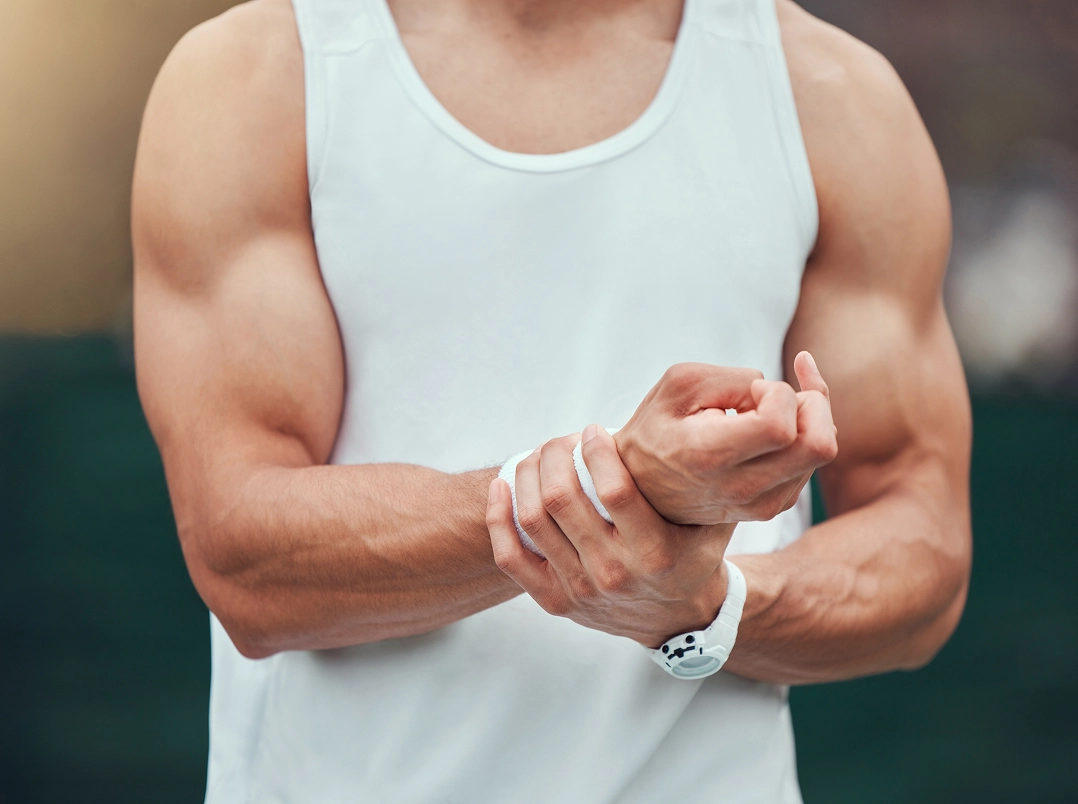 Man holding wrist - Memorial, TX Orthopaedic Hand, Wrist & Elbow Surgery