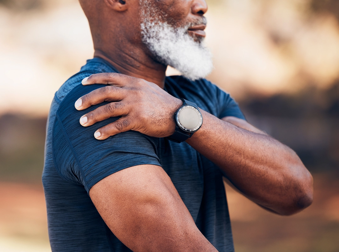 man holding his shoulder - Pasadena, TX Orthopaedic Hand, Wrist & Elbow Surgery